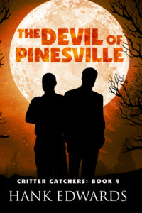 The Devil of Pinesville book cover showing a silhouette of two men in front of an orange tinted full moon with the title in the moon and author Hank Edwards